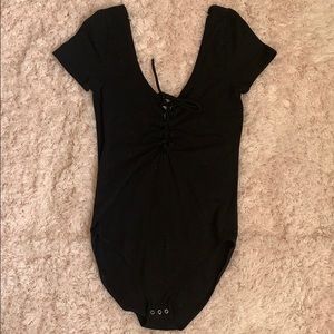 Lace up black bodysuit.